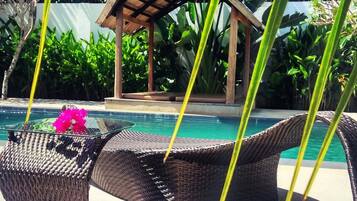 Outdoor pool, open 8 AM to midnight, pool loungers