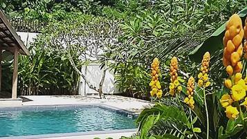 Outdoor pool, open 8 AM to midnight, pool loungers