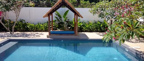 Outdoor pool, open 8 AM to midnight, pool loungers