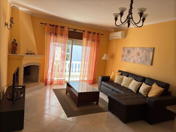 TV, fireplace, books - Our special place in Lagos, Portugal. Spacious, nicely furnished, great location (Lagos)