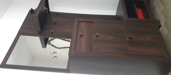 This villa comes with a living room and a fully equipped kitchen. 