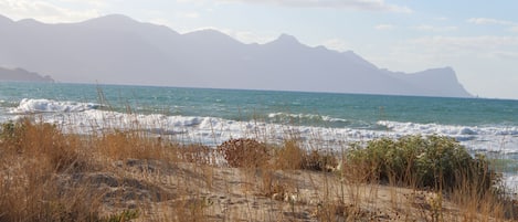 On the beach, sun-loungers, beach towels