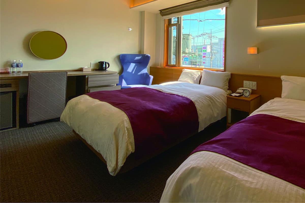 Standard Twin Room | Down comforters, desk, blackout drapes, iron/ironing board