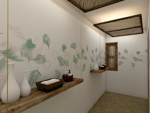 Un baño con tocador de madera, un espejo y una pared con diseño de hojas.
