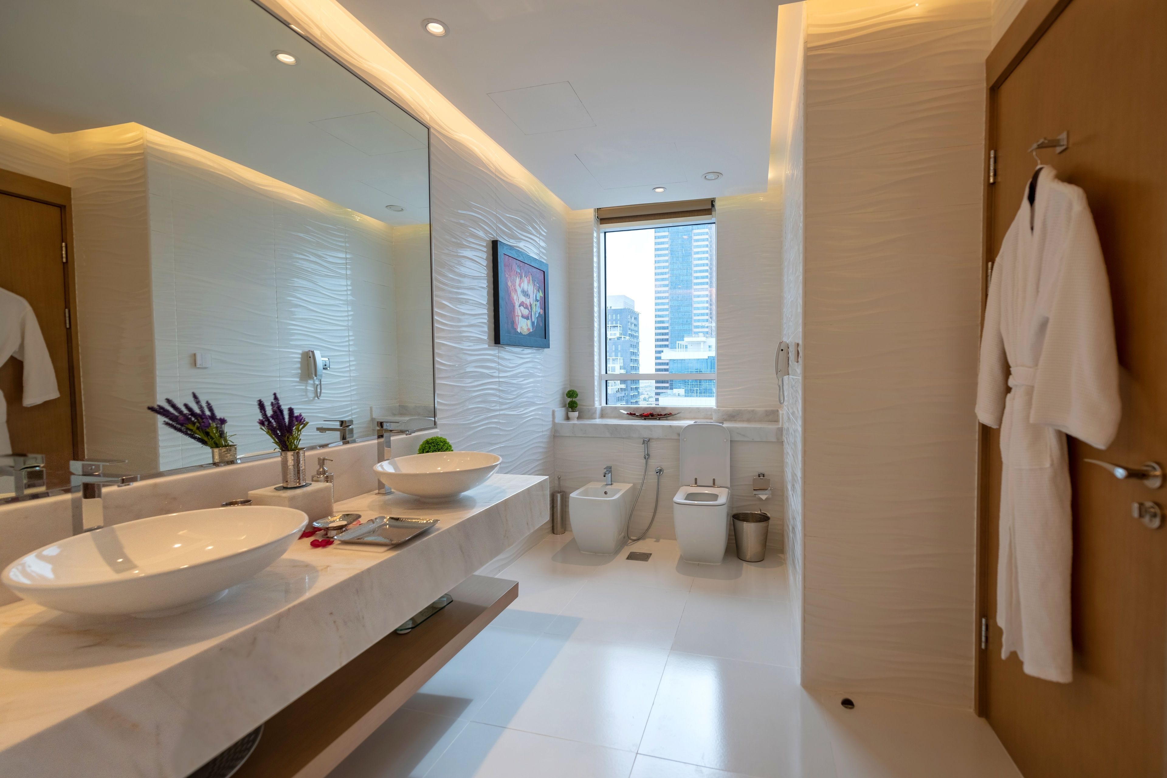 one bed room suite with access to the sister hotels private beach at palm jumeirah | bathroom | combined shower/bathtub, free toiletries, hair dryer, bathrobes