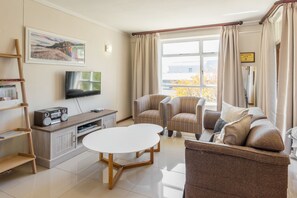 Executive Studio Suite | Living room | Flat-screen TV - Cascades Suite 1 (Cape Town)
