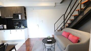 3-Bedroom Suite | Living area | Flat-screen TV