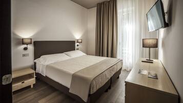 Superior kamer | 1 slaapkamer, een minibar, een kluis op de kamer, een bureau