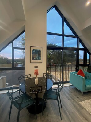 Exclusive Apartment | Living area | 55-inch flat-screen TV with cable channels