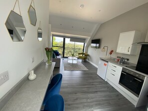 Exclusive Condo | Living area | 55-inch flat-screen TV with cable channels - Hotel Tia (Liverpool)