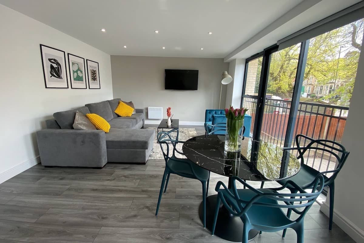 luxury condo | living area | 55-inch flat-screen tv with cable channels