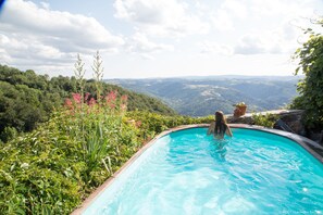 Seasonal outdoor pool, open 10:00 AM to 8:00 PM, pool loungers