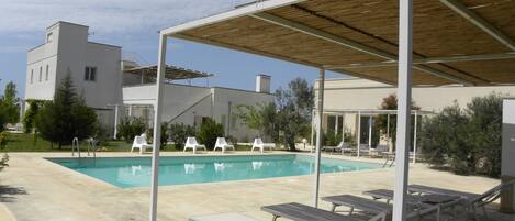 Seasonal outdoor pool, open 9 AM to 7 PM, pool umbrellas, sun loungers