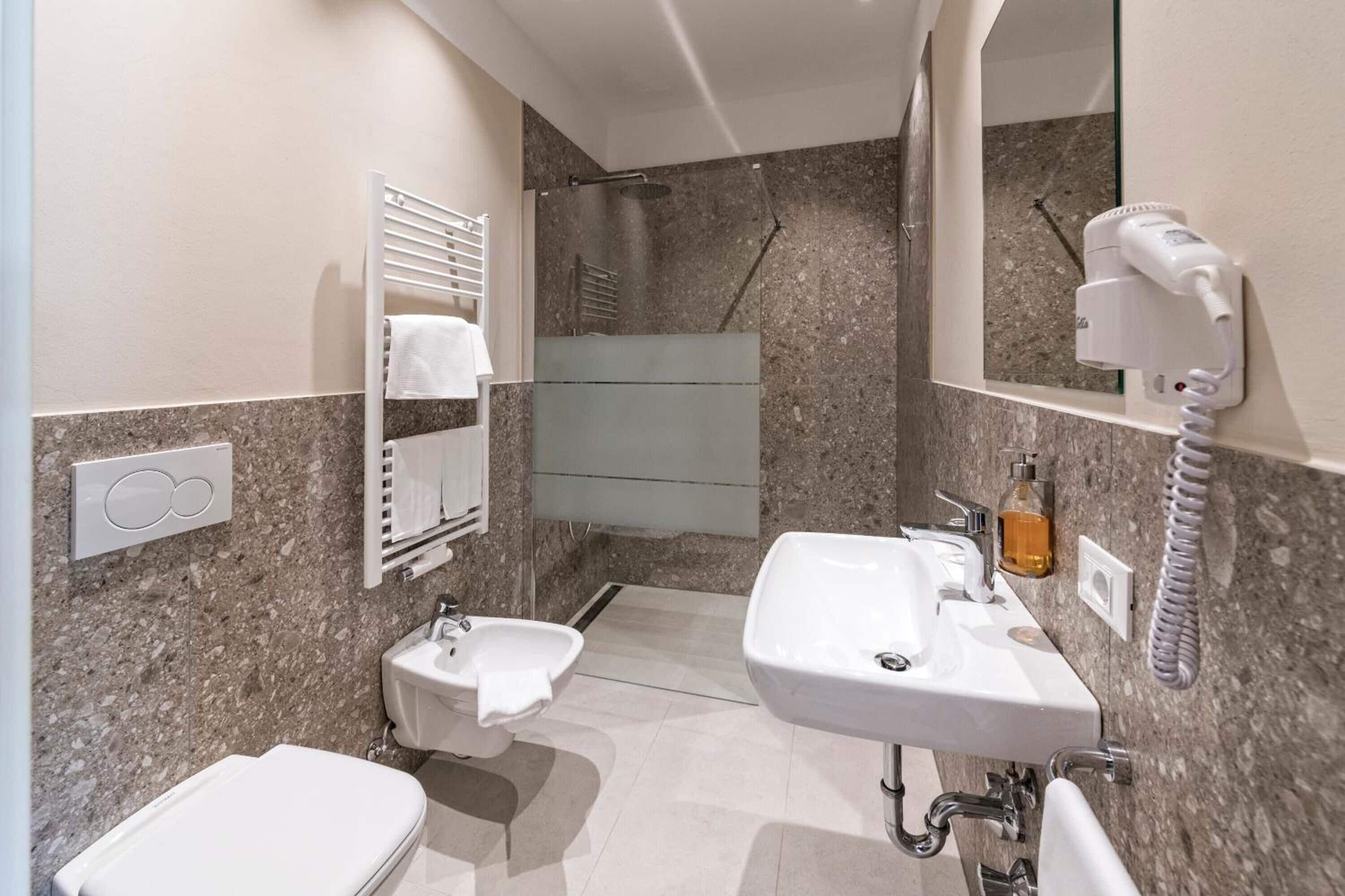 free toiletries, hair dryer, bidet, towels