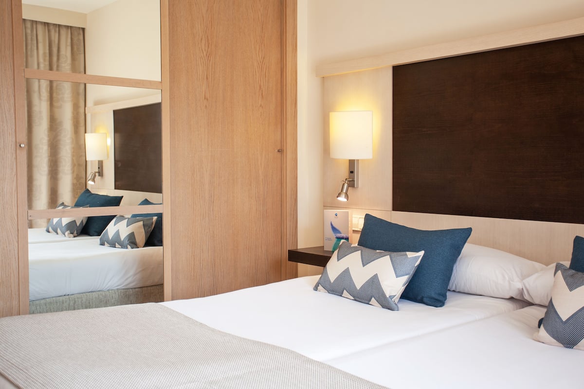 Desk, blackout curtains, free cots/infant beds, free WiFi