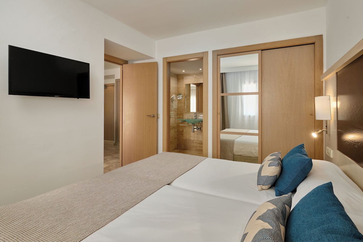 Desk, blackout drapes, cribs (free), WiFi (free)