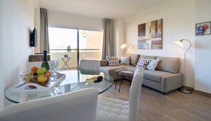 Superior Apartment | Living room | 43-inch flat-screen TV with satellite channels, TV - Apartment Club Playa Flores (Torremolinos)