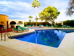 Outdoor pool, open 10 AM to 9:00 PM, pool umbrellas, pool loungers
