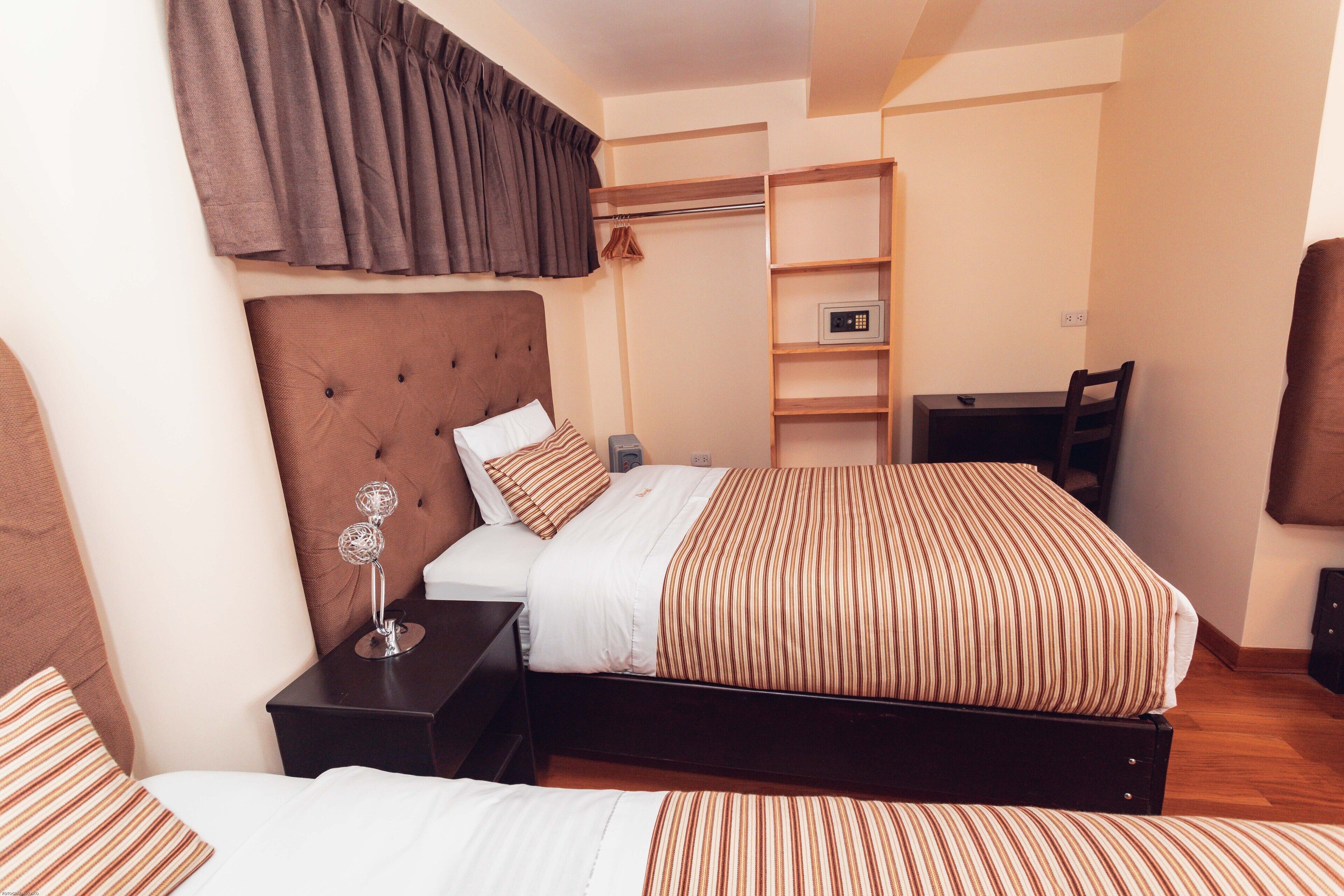 family quadruple room, multiple beds, private bathroom | 1 bedroom, down duvets, memory-foam beds, in-room safe