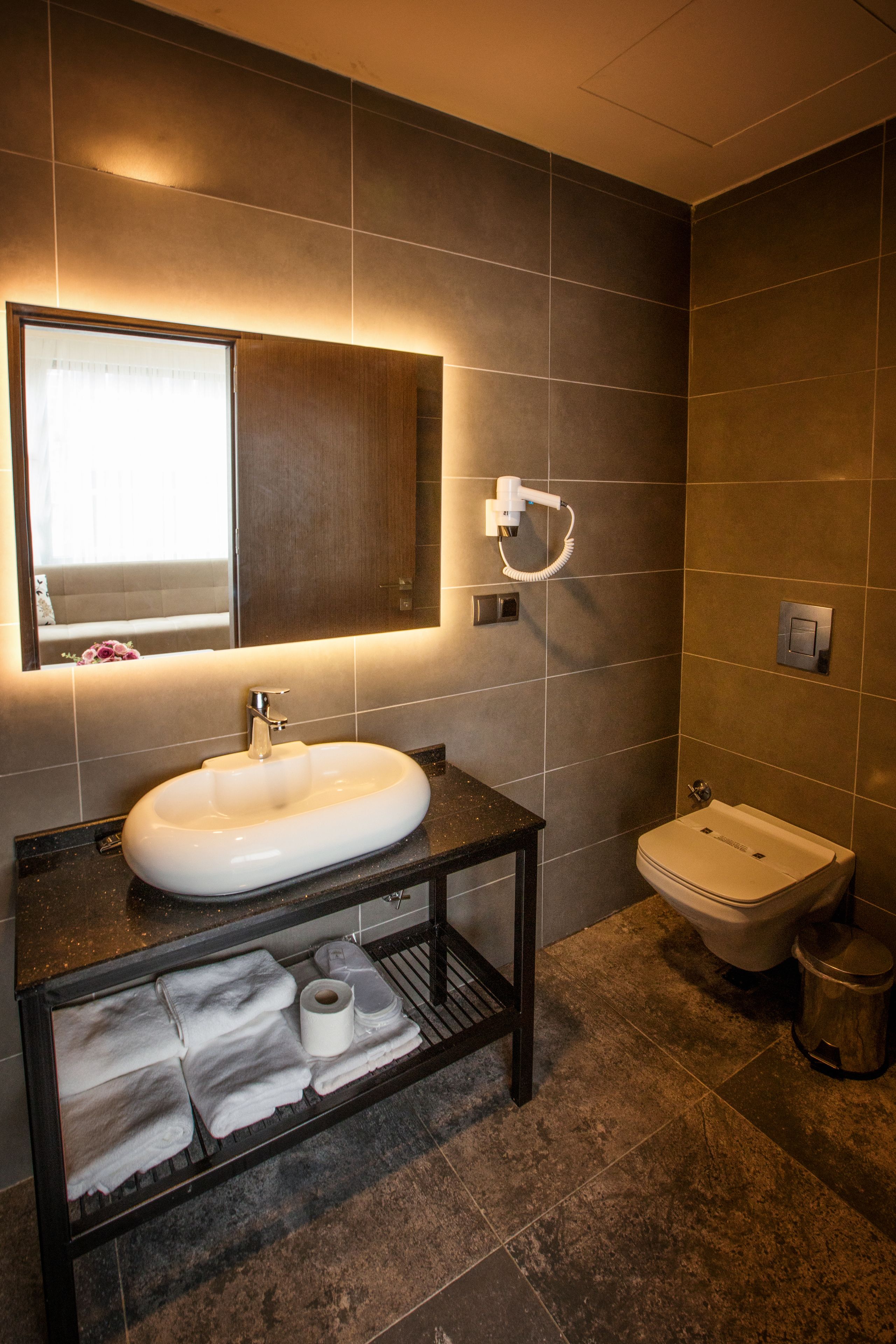 family suite, 1 queen bed with sofa bed | bathroom | shower, slippers, bidet, towels