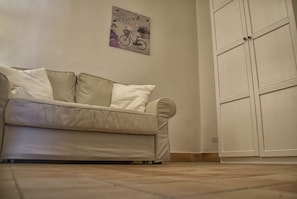 Familienzimmer, Terrasse | Wohnbereich | Flachbildfernseher