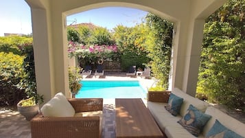 Outdoor pool, a heated pool, pool loungers