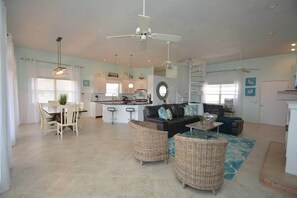 TV, fireplace, books, offices - Luxury Oceanfront | 4BR, 3 Masters, Pet Friendly (Palm Coast)