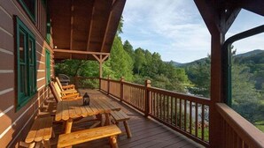 A wooden deck with benches and a railing overlooking a forested valley. - Water's Edge | Blue Ridge, GA (Blue Ridge)