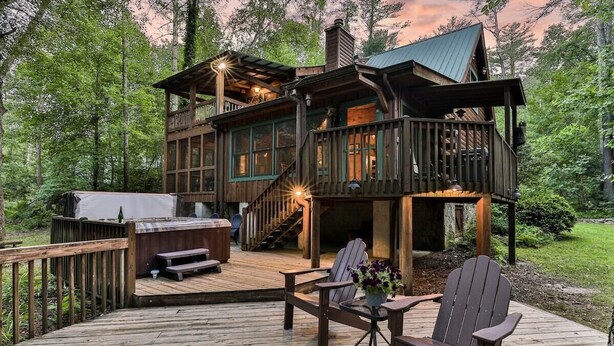 A multi-level wooden cabin with a deck, hot tub, and outdoor seating area. - Lofty Pines on the Cartecay | Ellijay, GA (Ellijay)