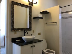 Shower, hair dryer, towels, toilet paper