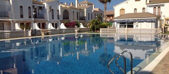 Delightful family villa in secure gated community with large pool.