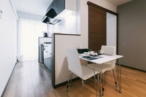 Standard Apartment, Non Smoking | In-room dining