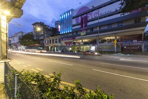 A hotel with multiple floors, a prominent sign for 'Hotel Simalungun', and a 'Grand Opening' banner. - Simms Grand Inn (Kuala Lumpur)