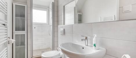 Bathtub, hair dryer, towels