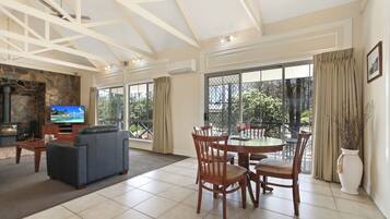 Salmon Company Cottage | Living area | Flat-screen TV, DVD player, books