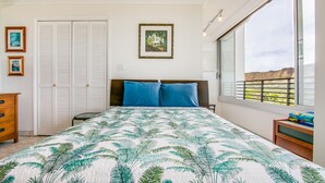 A bedroom with a bed, a nightstand, a dresser, a closet, and a window with a view. - 〰Waikiki〰Studio w/Spectacular Views & Balcony-WAIKIKI GRAND HOTEL® 712 (Honolulu)