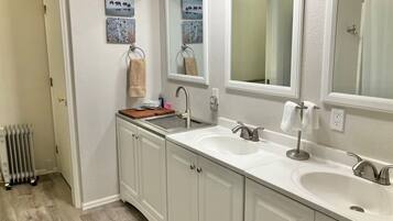Combined shower/tub, hair dryer, towels, soap