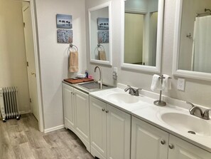 Combined shower/tub, hair dryer, towels, soap