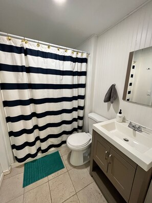 Bathtub, hair dryer, towels