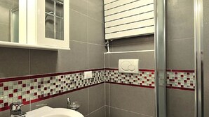 A bathroom with a sink, toilet, and shower. - Palace La Vida Apartments by Wonderful Italy (Venice)