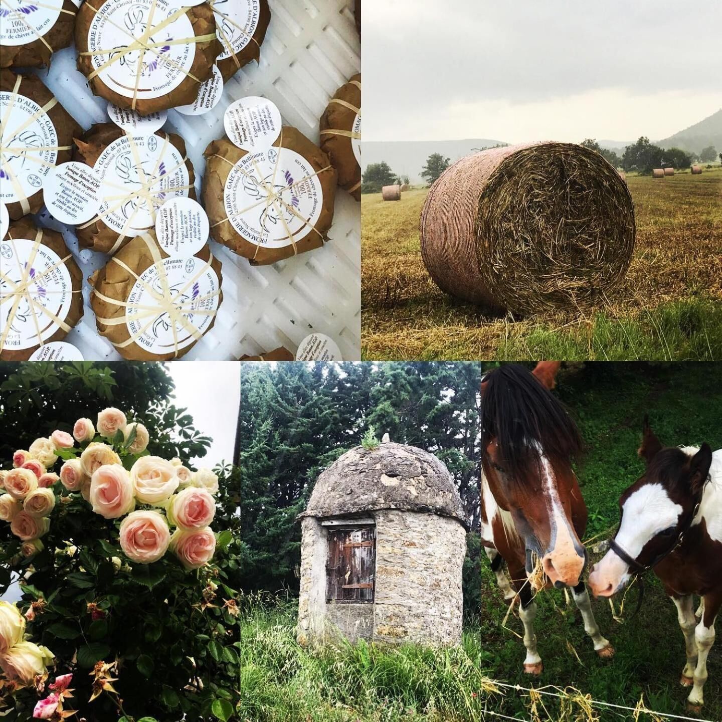 A rustic stone building, a field with hay bales, and a horse.