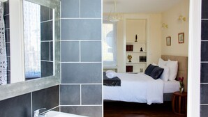 A bathroom with a large mirror and a sink, a bedroom with a bed and a nightstand, and a hallway with a door. - Valfrescos (Caurel)