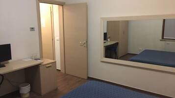 Economy Double Room | Minibar, in-room safe, desk, rollaway beds