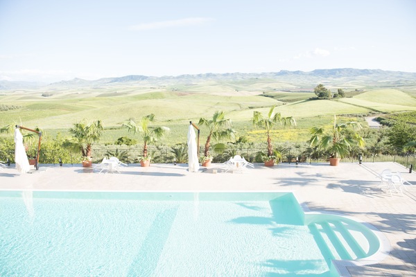 Seasonal outdoor pool, an infinity pool, pool umbrellas, sun loungers