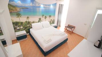 Deluxe Triple Room, Sea View | In-room safe, desk, soundproofing, iron/ironing board