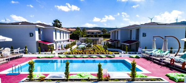 Outdoor pool, open 10:00 AM to 6:00 PM, pool umbrellas, pool loungers