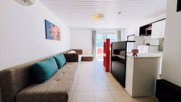 Vela Premium Dublex Pool View | Área de estar | TV LCD