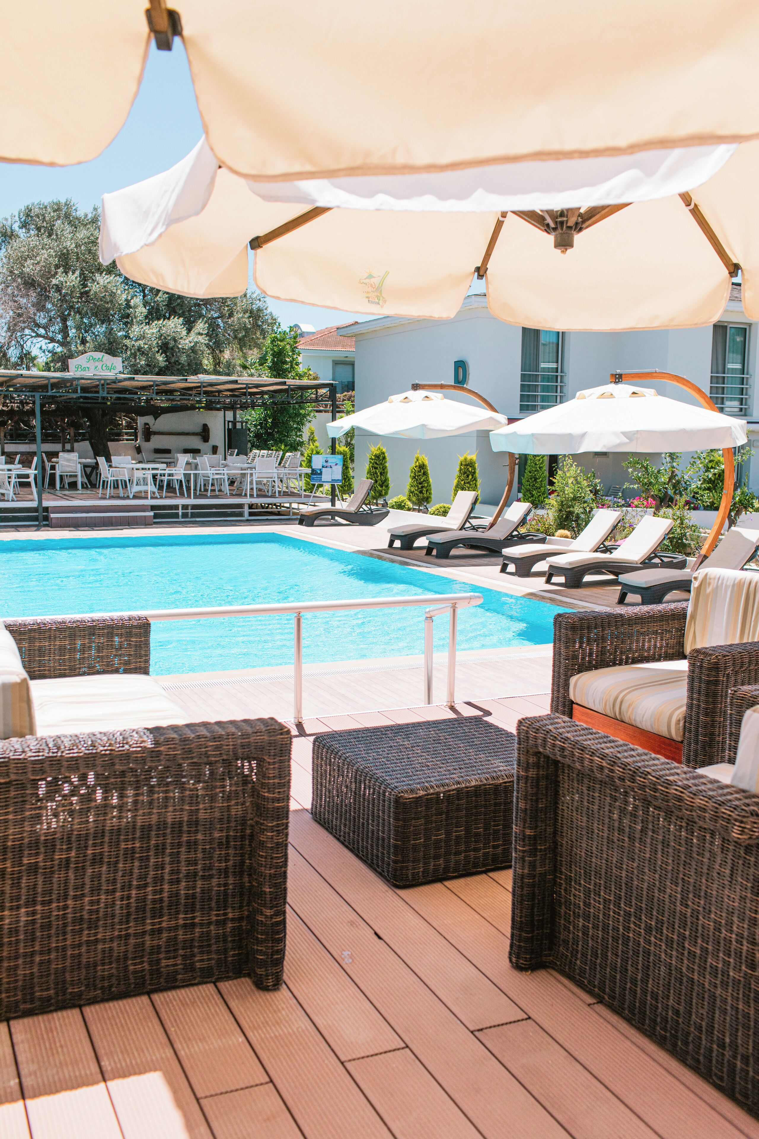 Outdoor pool, open 10:00 AM to 6:00 PM, pool umbrellas, pool loungers
