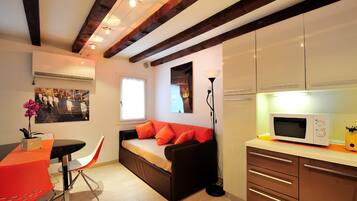 Apartment, 1 Bedroom | Living area | TV