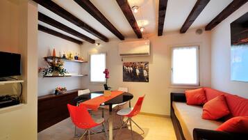 Apartment, 1 Bedroom | Living area | TV